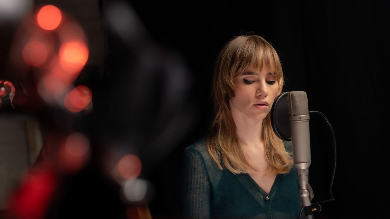 a woman singing into a microphone